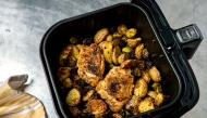 Air fryer chicken thighs with potatoes and Brussels Sprouts. (Photo by Peggy Cormary for The Washington Post)