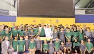 Participants of the Future Stars training camp pose for a photo with officials at the Aspire Academy.