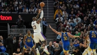 LeBron James #23 of the Los Angeles Lakers shoots over Stephen Curry #30 of the Golden State Warriors during the second half at Chase Center on December 25, 2024 in San Francisco, California. Thearon W. Henderson/Getty Images/AFP 