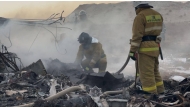 In this handout picture released by Kazakhstan's emergency situations ministry, emergency specialists work at the crash site of an Azerbaijan Airlines passenger jet near the western Kazakh city of Aktau on December 25, 2024. (Photo by Handout / Kazakhstan's emergency situations ministry / AFP) 