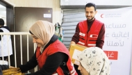 QRCS volunteers distributing meals to families in north Gaza  