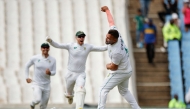 South Africa's Dane Paterson (R) celebrates with teammates after the dismissal of Pakistan's Salman Agha (unseen), and his fifth wicket for the day, during the first day of the first cricket Test match between South Africa and Pakistan at SuperSport Park in Centurion on December 26, 2024. (Photo by PHILL MAGAKOE / AFP)