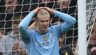 Manchester City's Norwegian striker #09 Erling Haaland reacts after having his penalty saved by Everton's English goalkeeper #01 Jordan Pickford during the English Premier League football match between Manchester City and Everton at the Etihad Stadium in Manchester, north west England, on December 26, 2024. (Photo by Darren Staples / AFP) 