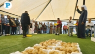 Residents and traders bid for boxes of truffles during the first day of auction yesterday. Pic: Marivie Alabanza/The Peninsula
