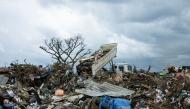 This photograph shows a truck unloading a garbages in a waste disposal site in the city of Tsountsou, on the French Indian Ocean territory of Mayotte on December 26, 2024. Photo by PATRICK MEINHARDT / AFP