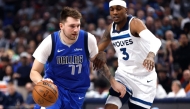 Luka Doncic #77 of the Dallas Mavericks handles the ball as Jaden McDaniels #3 of the Minnesota Timberwolves defends in the first half at American Airlines Center on December 25, 2024 in Dallas, Texas. Photo by Ron Jenkins / GETTY IMAGES NORTH AMERICA / Getty Images via AFP