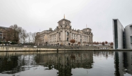 The Reichstag building, which houses Germany's lower house of parliament (Bundestag) is reflected in the river Spree in Berlin on December 27, 2024. Photo by John MACDOUGALL / AFP