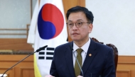 South Korea's Finance Minister and new acting president Choi Sang-mok speaks as he presides over a meeting of the National Security Council at the Government Complex in Seoul on December 27, 2024. (Photo by YONHAP / AFP) 