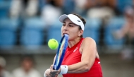 Switzerland's Belinda Bencic hits a return to France's Chloe Paquet during their women's singles match at the United Cup tennis tournament on Ken Rosewall Arena in Sydney on December 28, 2024. (Photo by David Gray / AFP) 