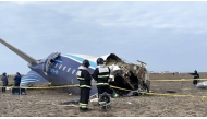 In this handout picture released by Kazakhstan's emergency situations ministry, emergency specialists work at the crash site of an Azerbaijan Airlines passenger jet near the western Kazakh city of Aktau on December 25, 2024. Photo by Handout / Kazakhstan's emergency situations ministry / AFP).