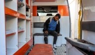 A man who was injured in a reported strike on a Palestinian civilian vehicle by Israeli forces, sits in an ambulance in Gaza City on December 22, 2024. Photo by Omar AL-QATTAA / AFP.
