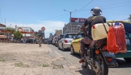 Motorists join long queues at a gas station in Maputo on December 27, 2024. (Photo by Amilton Neves / AFP)
