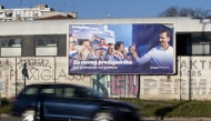 A car drives past an election poster of Presidential candidate of the Croatian Democratic Union (HDZ) party, Dragan Primorac that reads 