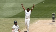 India's Jasprit Bumrah (C) celebrates the wicket of Australia's Mitchell Marsh (C) on day four of the fourth cricket Test match between Australia and India at the Melbourne Cricket Ground (MCG) in Melbourne on December 29, 2024. (Photo by Martin KEEP / AFP) 