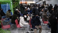 People and relatives of passengers of the crashed Jeju Air Boeing react at Muan International Airport in South Jeolla Province on December 29, 2024. (Photo by Jung Yeon-Je / AFP)