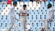 Pakistan's Mohammad Abbas (C) applauds as South Africa's Marco Jansen (L) and South Africa's Kagiso Rabada (R) celebrate South Africa winning the match during the fourth day of the first cricket Test match between South Africa and Pakistan at SuperSport Park in Centurion on December 29, 2024. (Photo by PHILL MAGAKOE / AFP)
