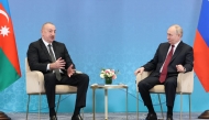 (FILES) In this pool photograph distributed by the Russian state agency Sputnik, Russia's President Vladimir Putin meets with Azerbaijani President Ilham Aliyev on the sidelines of the Shanghai Cooperation Organisation (SCO) member states leaders' summit in Astana on July 3, 2024. (Photo by Sergei SAVOSTYANOV / POOL / AFP)
