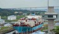 A cargo ship sails through the Agua Clara Locks of the Panama Canal in Colon City, Panama, on December 28, 2024. (Photo by ARNULFO FRANCO / AFP)
