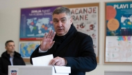 Croatia's outgoing President and Social Democratic Party (SDP) presidential candidate Zoran Milanovic casts his ballot to vote in the country's presidential elections at a polling station in Zagreb on December 29, 2024. (Photo by AFP)
