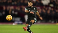 Liverpool's Egyptian striker #11 Mohamed Salah shoots but fails to score during the English Premier League football match between West Ham United and Liverpool at the London Stadium, in London on December 29, 2024. (Photo by Adrian Dennis / AFP)