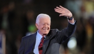 (Files) Former President Jimmy Carter waves to the crowd at the Democratic National Convention 2008 at the Pepsi Center in Denver, Colorado, on August 25, 2008. (Photo by Robyn Beck / AFP)