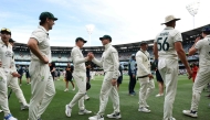 Australian players celebrate after winning the match on day five of the fourth cricket Test match between Australia and India at the Melbourne Cricket Ground (MCG) in Melbourne on December 30, 2024. (Photo by Martin Keep / AFP)