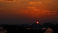 The sun sets over the marina along Al-Wakra corniche south of Qatar's capital Doha on December 25, 2024. (Photo by Karim Jaafar / AFP)
