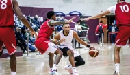 Al Sadd's Grant Michael Dressler (centre) dribbles during the match against Al Shamal.