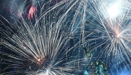 Fireworks illuminate the Quadriga atop the Brandenburg Gate during the New Year celebrations in Berlin on January 1, 2025. (Photo by Tobias SCHWARZ / AFP)