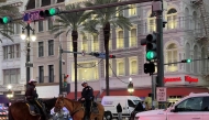 Police cordon off the intersection of Canal Street and Bourbon Street in the French Quarter of New Orleans, Louisiana, on January 1, 2025. (Photo by Matthew HINTON / AFP)
