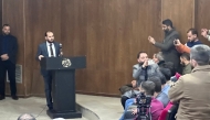 Syrian Minister of Information Mohamed al-Omar speaks to members of the media during a meeting in Damascus on December 31, 2024. (Photo by Bakr Alkasem / AFP)

