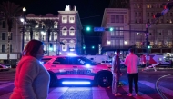 People look at a blocked off road from Canal Street after at least 15 people were killed on Bourbon Street, after an attack early in the morning, on January 1, 2025 in New Orleans, Louisiana.  (Photo by Andrew Caballero-Reynolds / AFP)