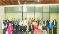 Participants and officials pose for a group photograph during the programme.