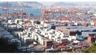 Containers are stacked at a port in the southeastern city of Busan. 