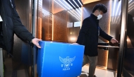 Police officers conduct a raid at Muan International Airport in Muan, some 288 kilometres southwest of Seoul on January 2, 2025. Photo by YONHAP / AFP