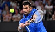 Novak Djokovic of Serbia hits a return during his men's singles match against Gael Monfils of France at the Brisbane International tennis tournament in Brisbane on January 2, 2025. (Photo by William WEST / AFP)