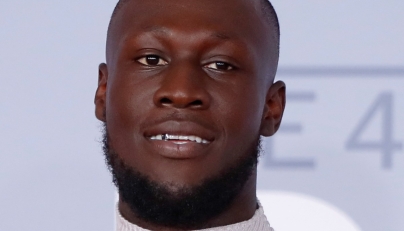 British grime and hip-hop artist Stormzy poses on the red carpet on arrival for the BRIT Awards 2020 in London on February 18, 2020. Photo by Tolga AKMEN / AFP