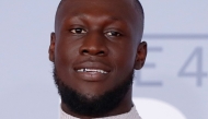 British grime and hip-hop artist Stormzy poses on the red carpet on arrival for the BRIT Awards 2020 in London on February 18, 2020. Photo by Tolga AKMEN / AFP