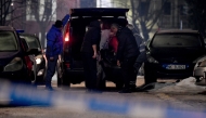 Civil defence members carry body of a victim from a crime scene after a gunman killed several people in the village of Bajice near Cetinje, on January 1, 2025. Photo by SAVO PRELEVIC / AFP