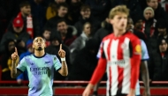 Arsenal's Brazilian striker #09 Gabriel Jesus (L) celebrates after scoring his team first goal during the English Premier League football match between Brentford and Arsenal at the Gtech Community Stadium in London on January 1, 2025. (Photo by JUSTIN TALLIS / AFP)