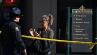 A woman speaks with a police officer near a blocked off street in the French Quarter on January 2, 2025 in New Orleans, Louisiana. (Photo by Andrew Caballero-Reynolds / AFP)