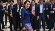 Thailand's Prime Minister Paetongtarn Shinawatra holds a handbag as she arrives to attend the gala dinner during the 44th and 45th Association of Southeast Asian Nations (ASEAN) Summits in Vientiane on October 10, 2024. Photo by TANG CHHIN SOTHY / POOL / AFP