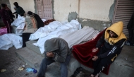 Palestinians mourn over the bodies of relatives killed in an Israeli strike, outside a hospital in Deir el-Balah in the central Gaza Strip on January 3, 2025. Photo by Eyad BABA / AFP.