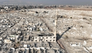 An aerial view shows the destruction in the Damascus district of Assali on January 2, 2025. (Photo by Bakr Alkasem / AFP)