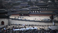 People gather for a rally to protest against impeached South Korea's president Yoon Suk Yeol is seen in front of the Gwanghwamun Gate in Seoul on January 4, 2025. (Photo by Philip FONG / AFP)