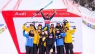 First placed Sweden's Sara Hector (C) poses with her team during the podium ceremony after winning the Women's Giant Slalom event as part of the FIS Alpine ski world Cup 2024-2025 in Kranjska Gora, Slovenia, on January 4, 2025. (Photo by Jure Makovec / AFP)
