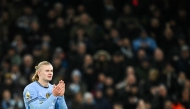 Manchester City's Norwegian striker #09 Erling Haaland applauds as he leaves the pitch during the English Premier League football match between Manchester City and West Ham United at the Etihad Stadium in Manchester, north west England, on January 4, 2025. (Photo by Oli SCARFF / AFP)