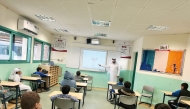 An NHRC official delivers a lecture in a classroom.