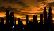 Buildings are seen during sunset in Jakarta on January 5, 2025. (Photo by Yasuyoshi CHIBA / AFP)