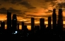 Buildings are seen during sunset in Jakarta on January 5, 2025. (Photo by Yasuyoshi CHIBA / AFP)